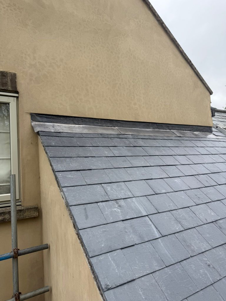 Newly installed leadwork on a slate roof in Oakhill Somerset