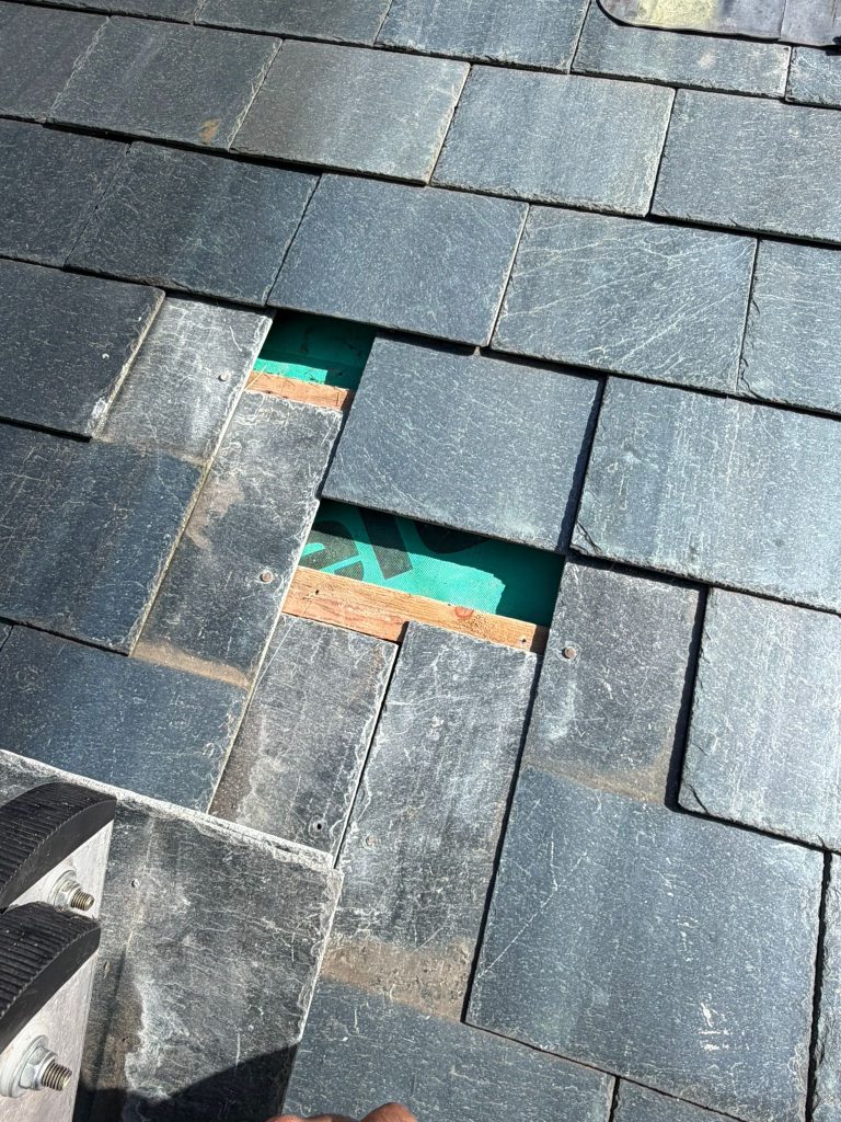 Slate roof tiles that have slipped off