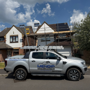 Mendip Roofing Contractors van outside a housde undergoing roof repairs
