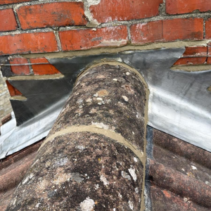 A close up of newly installed leadwork flashing on a chimney