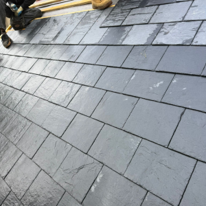 A slate roof being repaired in Okahill Somerset